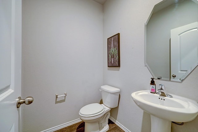 14242 W Pine Heart Dr, Conroe, TX 77302 - half bath with wood finished floors and toilet