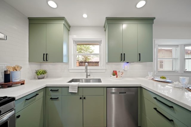 5730 Chrystell Ln, Houston, TX 77092 - kitchen with stainless steel appliances, green cabinetry, and recessed lighting