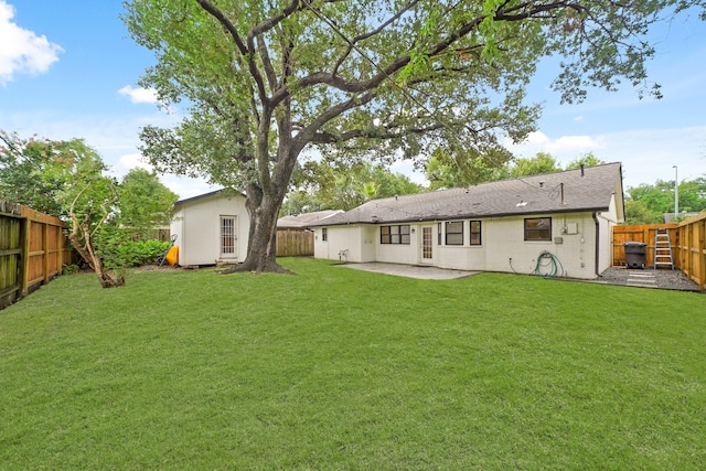 5730 Chrystell Ln, Houston, TX 77092 - back of property featuring a fenced backyard, a patio area, brick siding, and a shed