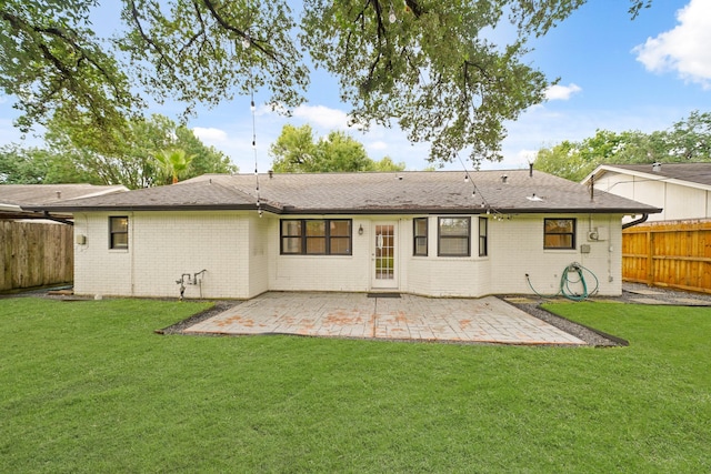 5730 Chrystell Ln, Houston, TX 77092 - back of property featuring brick siding, a patio area, and a fenced backyard
