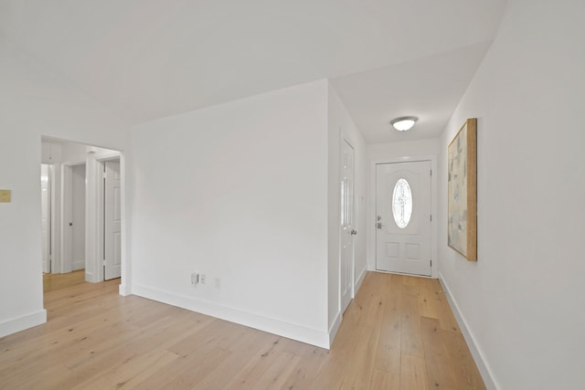 5730 Chrystell Ln, Houston, TX 77092 - entryway with light wood-type flooring and baseboards