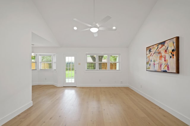 5730 Chrystell Ln, Houston, TX 77092 - empty room with a ceiling fan, plenty of natural light, light wood-style floors, recessed lighting, and high vaulted ceiling