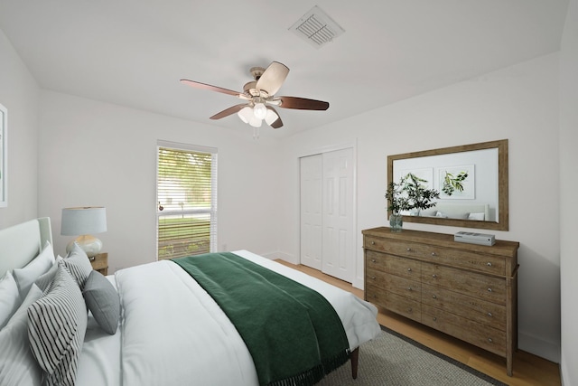 5730 Chrystell Ln, Houston, TX 77092 - bedroom featuring a closet, a ceiling fan, and wood finished floors