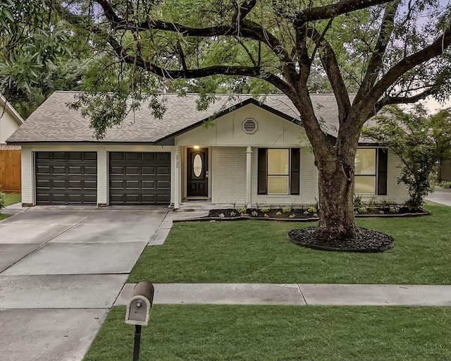 5730 Chrystell Ln, Houston, TX 77092 - single story home with concrete driveway, a shingled roof, brick siding, a garage, and a front yard