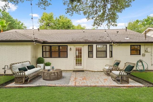 5730 Chrystell Ln, Houston, TX 77092 - rear view of house with brick siding, a patio area, a lawn, and an outdoor hangout area
