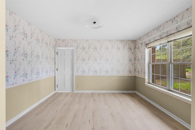 3315 Crestdale Dr, Houston, TX 77080 - unfurnished room featuring wood finished floors and wallpapered walls