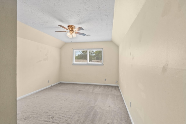 3315 Crestdale Dr, Houston, TX 77080 - unfurnished room featuring vaulted ceiling, carpet floors, ceiling fan, and a textured ceiling