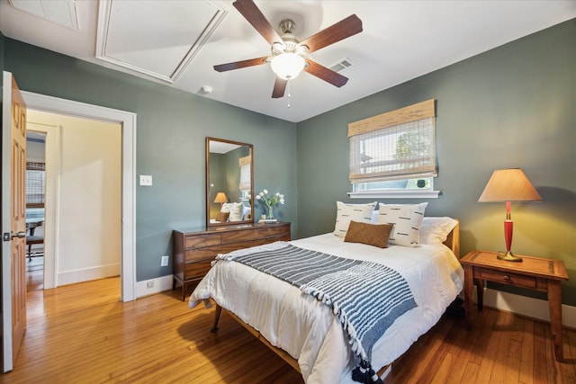 711 Pizer St, Houston, TX 77009 - bedroom featuring light wood finished floors, attic access, and a ceiling fan