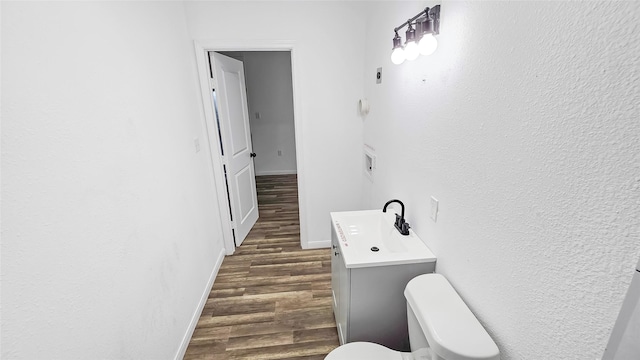 2235 Hutton St, Houston, TX 77026 - half bathroom featuring wood finished floors and vanity