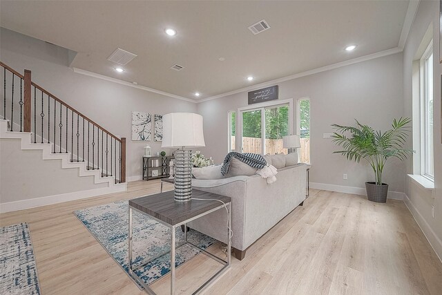 3835 Mainer St, Houston, TX 77021 - living area with ornamental molding, light wood-type flooring, recessed lighting, and stairs