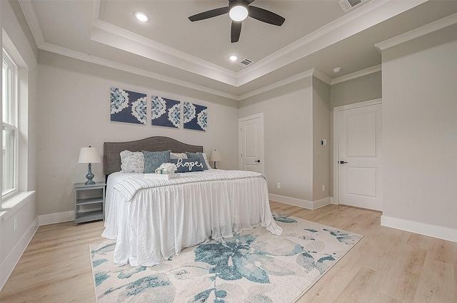 3835 Mainer St, Houston, TX 77021 - bedroom featuring a raised ceiling, light wood finished floors, ornamental molding, ceiling fan, and recessed lighting