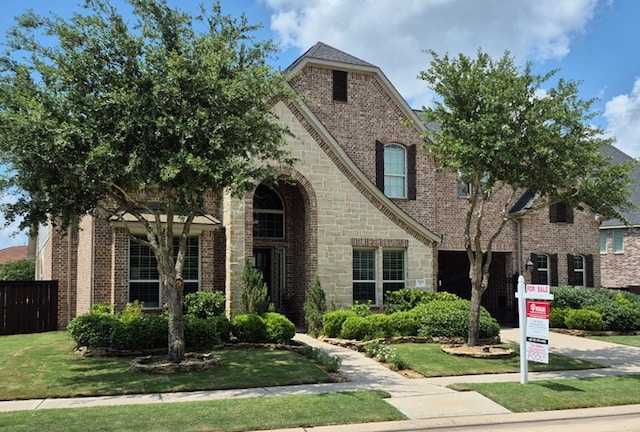 7106 Prairie Grass Ln, Katy, TX 77493 - view of front of home with stone siding and brick siding