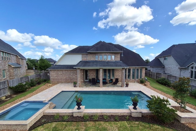 7106 Prairie Grass Ln, Katy, TX 77493 - view of swimming pool featuring an in-ground hot tub, a patio, and a fenced backyard