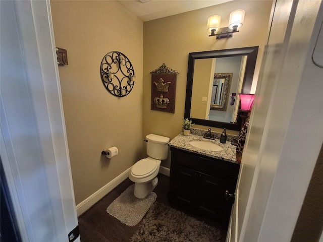 7106 Prairie Grass Ln, Katy, TX 77493 - half bathroom with vanity and wood finished floors