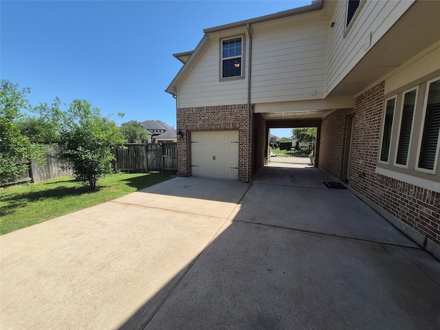 7106 Prairie Grass Ln, Katy, TX 77493 - view of side of property featuring brick siding, an attached garage, and concrete driveway