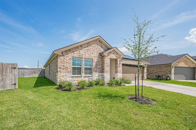 903 Curly Angora Ct, Rosharon, TX 77583 - view of front of property with an attached garage, concrete driveway, brick siding, and stone siding