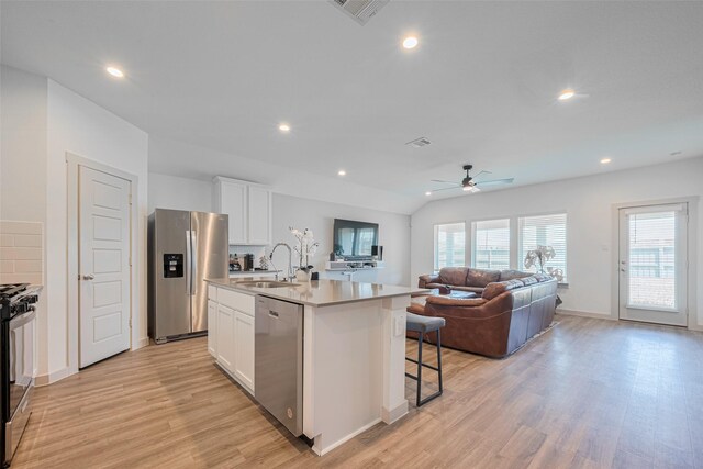 903 Curly Angora Ct, Rosharon, TX 77583 - kitchen featuring stainless steel appliances, a ceiling fan, light wood-style floors, white cabinetry, and recessed lighting