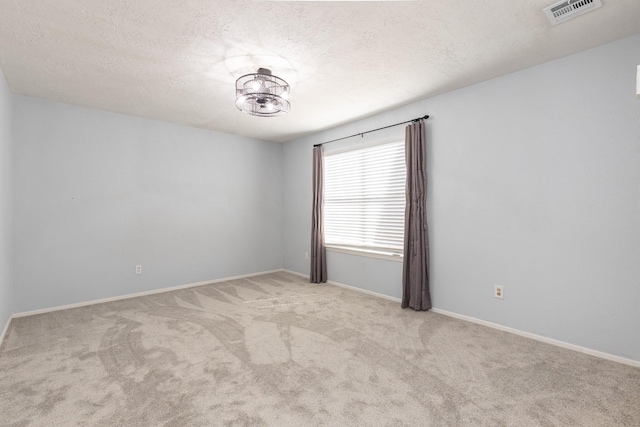 9938 Rustic Rock Rd, La Porte, TX 77571 - empty room featuring carpet floors and a textured ceiling