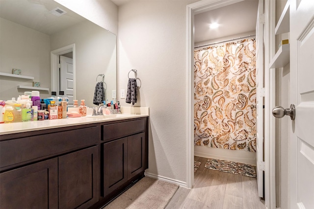 1614 Chase Anchor Ct, Richmond, TX 77469 - bathroom featuring vanity, wood finished floors, and shower / bath combination with curtain