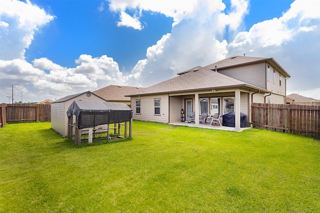 1614 Chase Anchor Ct, Richmond, TX 77469 - rear view of property featuring a fenced backyard and a patio area
