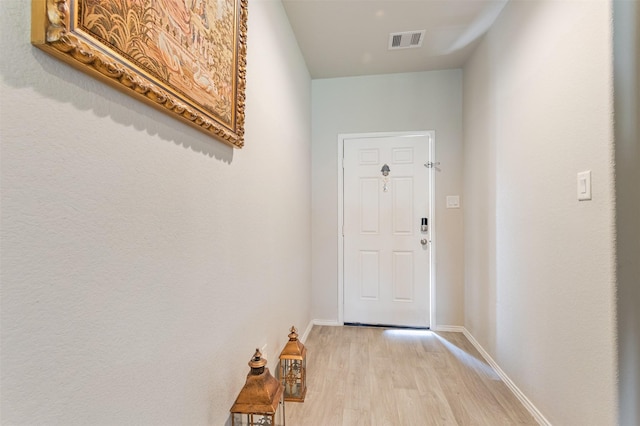 1614 Chase Anchor Ct, Richmond, TX 77469 - doorway featuring light wood finished floors and baseboards