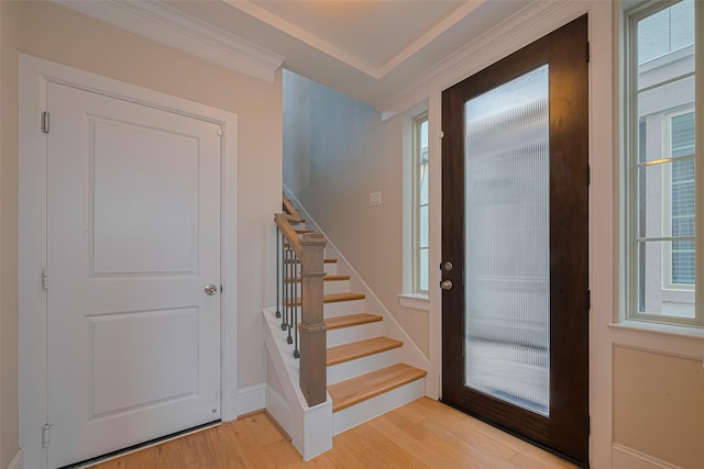 8324 Ginger Oak St, Houston, TX 77055 - entrance foyer with ornamental molding, light wood-style flooring, stairs, and plenty of natural light