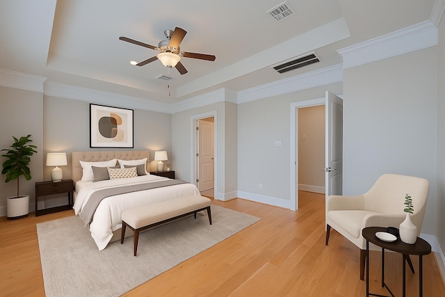 8324 Ginger Oak St, Houston, TX 77055 - bedroom with a raised ceiling, light wood finished floors, crown molding, and ceiling fan