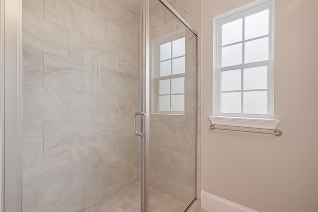 8324 Ginger Oak St, Houston, TX 77055 - bathroom featuring a shower stall and baseboards