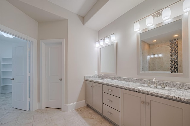 8324 Ginger Oak St, Houston, TX 77055 - bathroom with double vanity, tiled shower, and marble look tile flooring