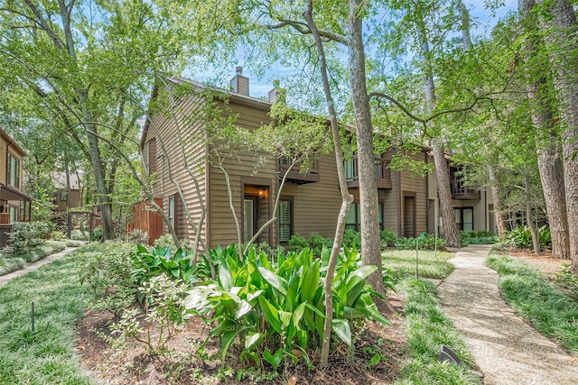 11711 Memorial Dr Unit 213, Houston, TX 77024 - view of front of house featuring a chimney