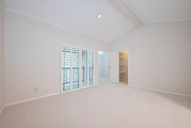 11711 Memorial Dr Unit 213, Houston, TX 77024 - unfurnished bedroom featuring light carpet, a walk in closet, and crown molding