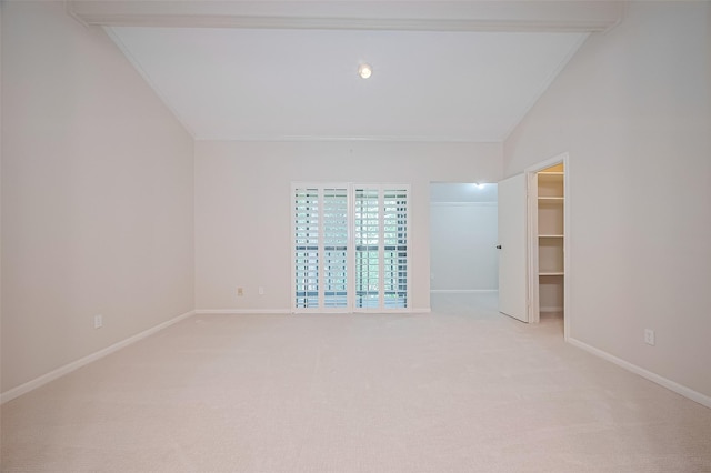 11711 Memorial Dr Unit 213, Houston, TX 77024 - unfurnished room featuring ornamental molding, light carpet, and vaulted ceiling
