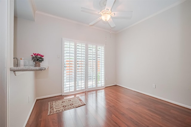 11711 Memorial Dr Unit 213, Houston, TX 77024 - spare room with wood finished floors, a ceiling fan, and crown molding