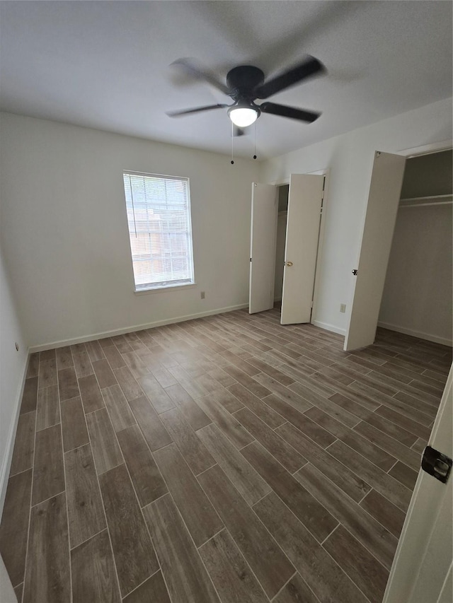 8941 Gaylord St Unit 211, Houston, TX 77024 - unfurnished bedroom with dark wood finished floors and ceiling fan