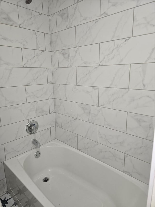 8941 Gaylord St Unit 211, Houston, TX 77024 - bathroom featuring washtub / shower combination