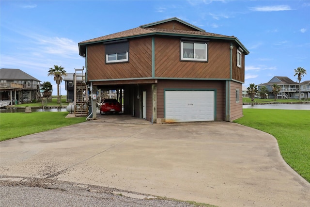 174 Sand Shoals Rd, Freeport, TX 77541 - view of front facade featuring a water view, a garage, stairs, and a front yard
