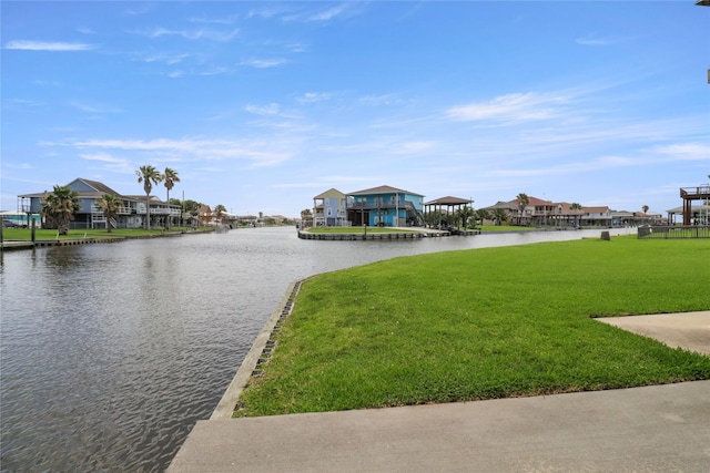 174 Sand Shoals Rd, Freeport, TX 77541 - dock area with a water view, a yard, and a residential view