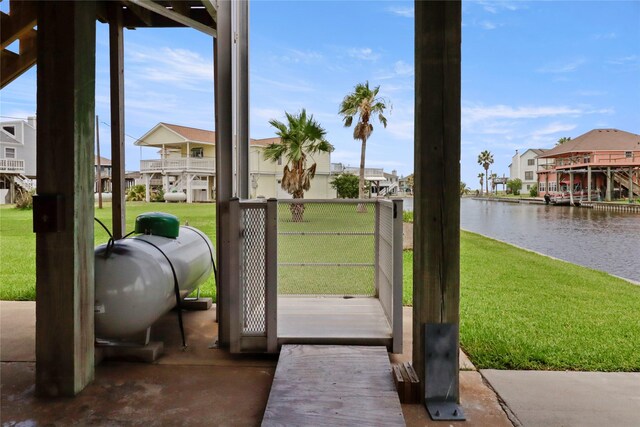 174 Sand Shoals Rd, Freeport, TX 77541 - doorway with a water view, a residential view, and plenty of natural light