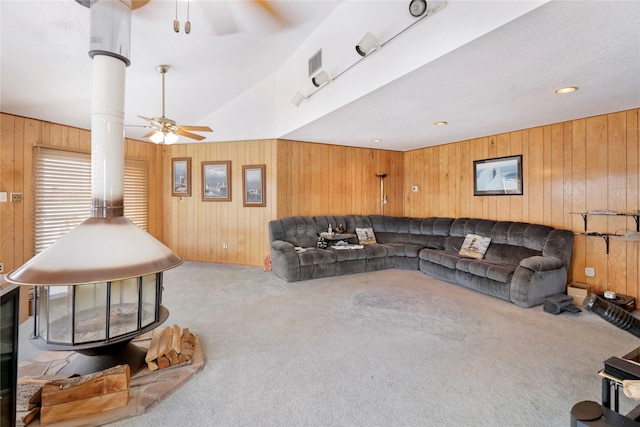 174 Sand Shoals Rd, Freeport, TX 77541 - living area with a ceiling fan, carpet flooring, and wooden walls