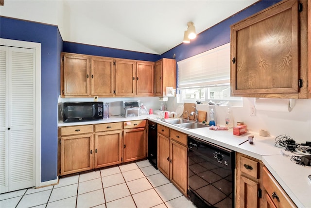 174 Sand Shoals Rd, Freeport, TX 77541 - kitchen with black appliances, lofted ceiling, light countertops, brown cabinets, and light tile patterned floors