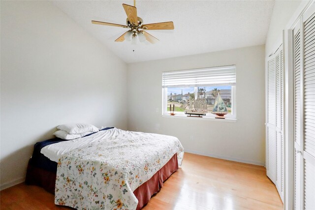 174 Sand Shoals Rd, Freeport, TX 77541 - bedroom featuring vaulted ceiling, light wood-style flooring, and a ceiling fan
