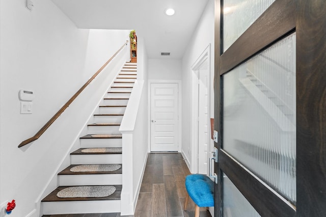 2753 Clinton Dr, Houston, TX 77020 - staircase featuring wood finished floors and recessed lighting