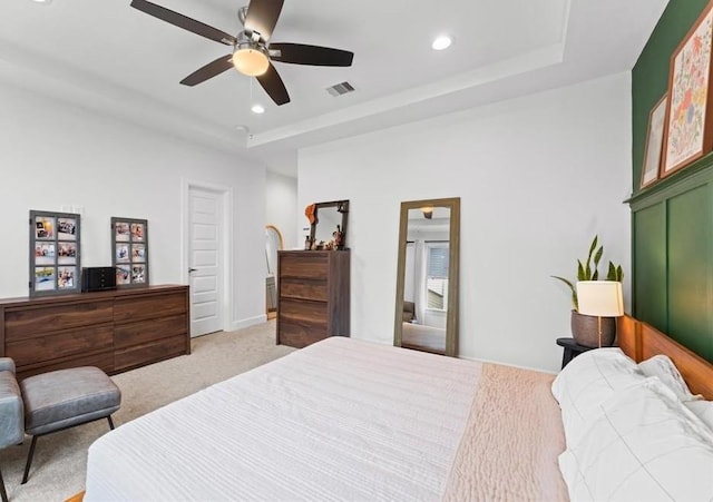 2753 Clinton Dr, Houston, TX 77020 - bedroom with a raised ceiling, light carpet, recessed lighting, and ceiling fan