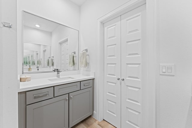 2753 Clinton Dr, Houston, TX 77020 - bathroom with vanity, a closet, and wood finished floors