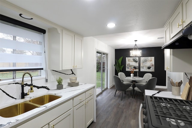 7706 Garsee Dr, Houston, TX 77040 - kitchen featuring white cabinetry, dark wood-type flooring, range with gas cooktop, and recessed lighting