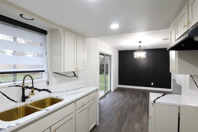 7706 Garsee Dr, Houston, TX 77040 - kitchen featuring white cabinets, light countertops, dark wood-type flooring, and recessed lighting