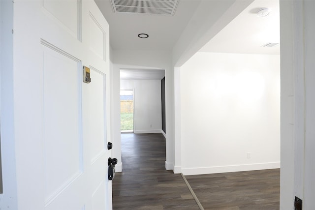 7706 Garsee Dr, Houston, TX 77040 - hallway with dark wood-type flooring and baseboards