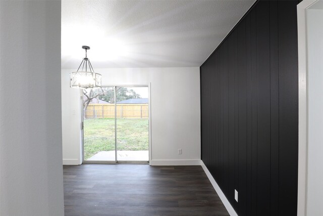 7706 Garsee Dr, Houston, TX 77040 - unfurnished room with a chandelier and dark wood finished floors