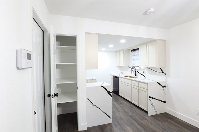 7706 Garsee Dr, Houston, TX 77040 - kitchen featuring dark wood-type flooring, black dishwasher, light countertops, white cabinets, and recessed lighting