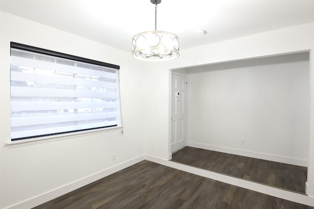7706 Garsee Dr, Houston, TX 77040 - empty room with a chandelier and dark wood-style floors